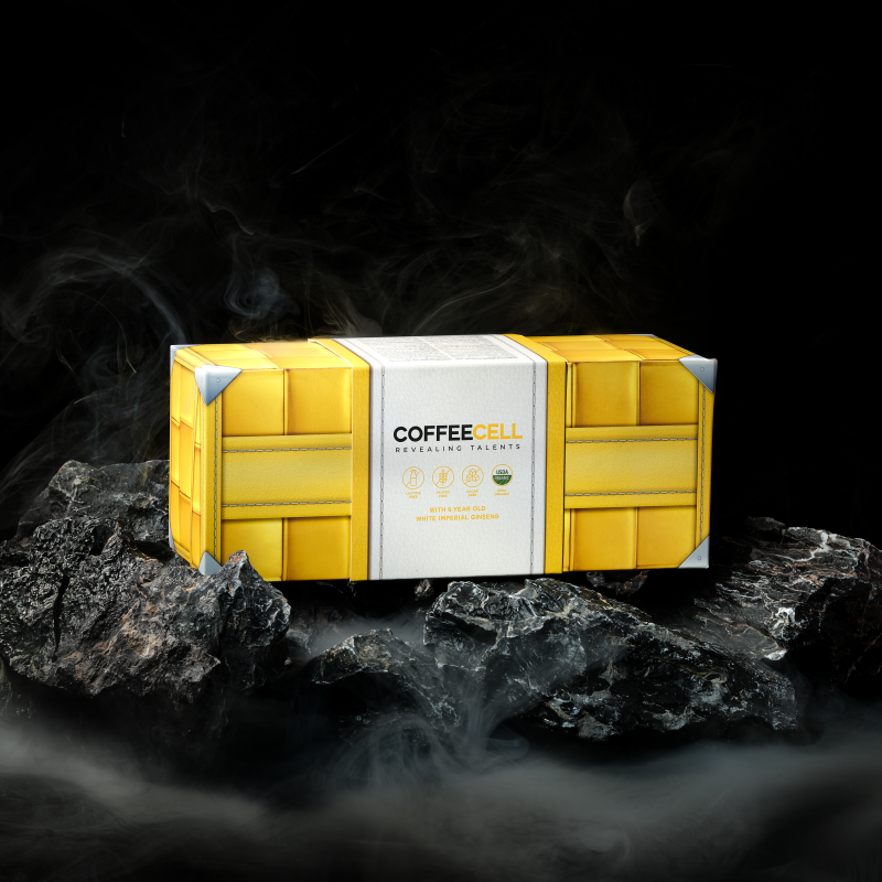 Желтая коробка COFFEECELL с черным кофе на камнях